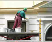 Execution of restoration works. The house painter behind work.