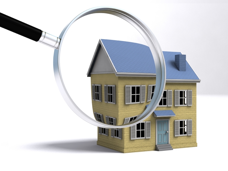 A magnifying glass examining a house. 3D render with HDRI lighting and raytraced textures.