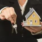 House and Keys in Female Hands