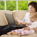 clipping path! mother with daughter on the sofa