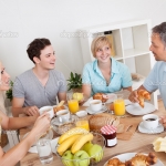 Happy family enjoying breakfast